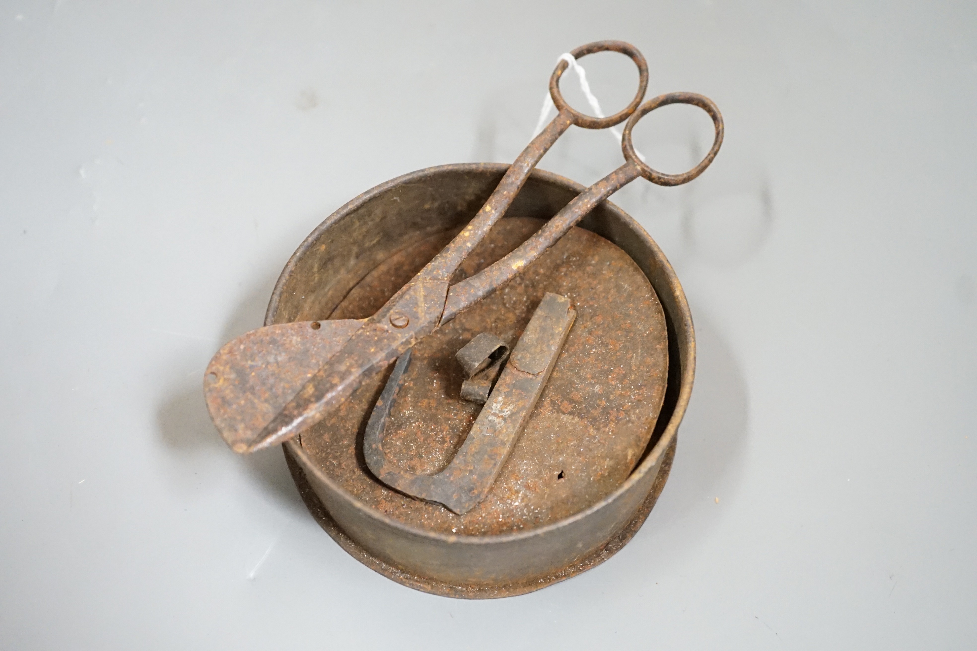 A 19th century tinder box, flint and strike and a pair of wick cutters